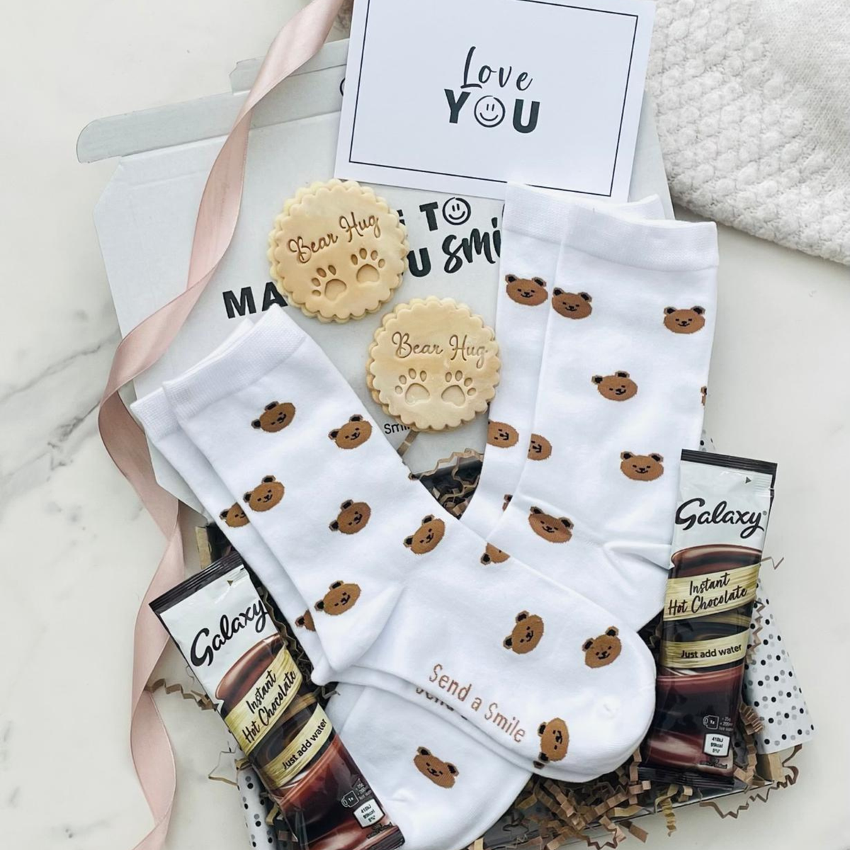 His & Hers anniversary gift box with matching bear print socks, hot chocolate and bear hug cookies a cute couples gift for anniversaries.