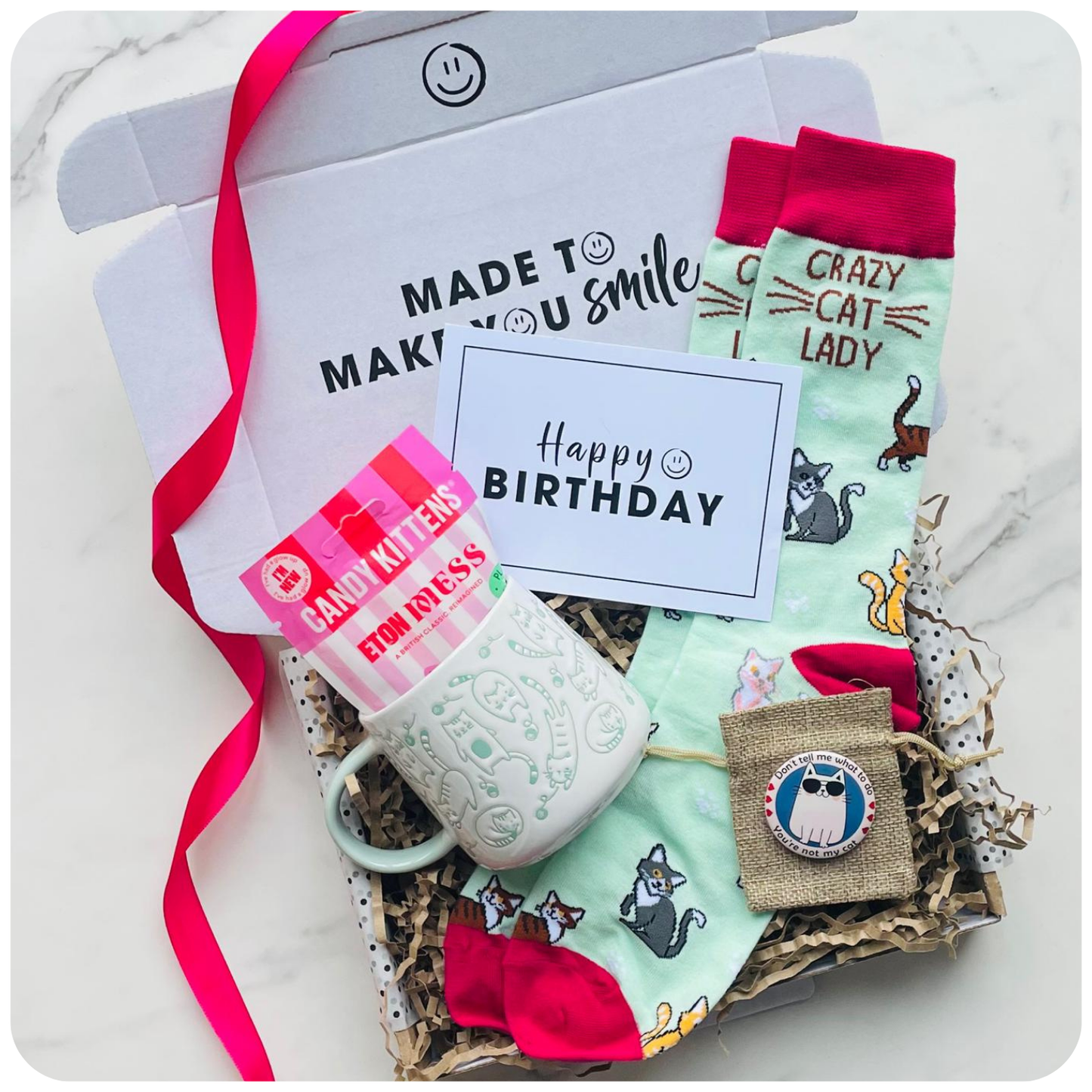 Gift for cat lover. Cat mug, cat socks, candy kittens and a cat badge