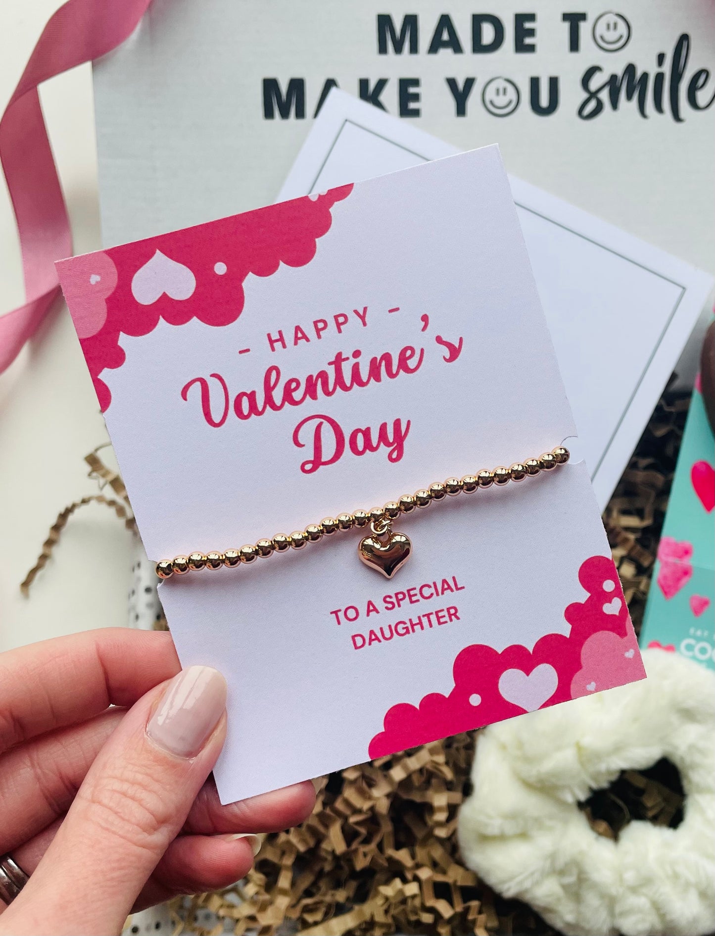 Valentines day bracelet for daughter. A gold bracelet with a heart on a backing card that reads, Happy Valentines Day to a special daughter  