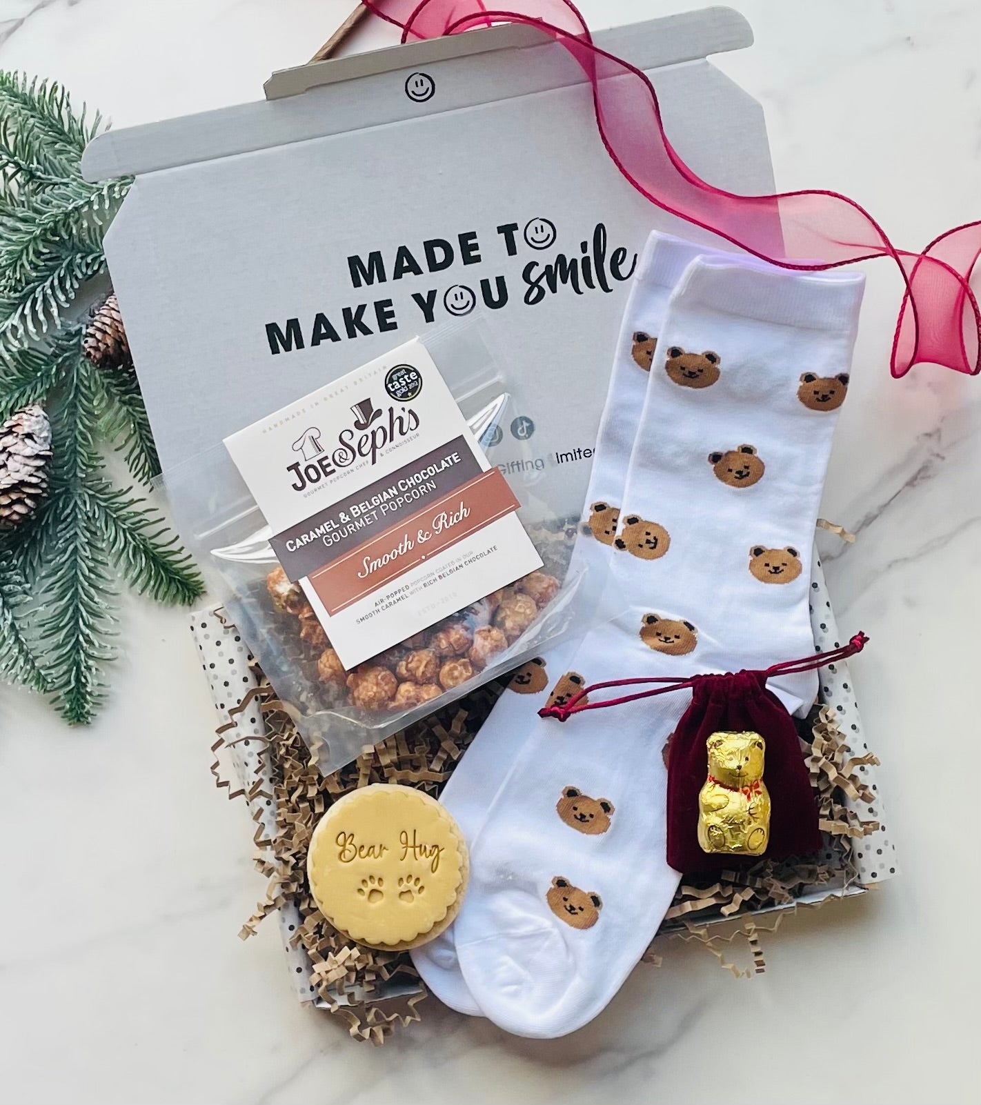 Have a beaarry merry christmas gift box for him. Including cosy bear socks, gourmet popcorn, Artisan coffe bag and a bear hug iced biscuit